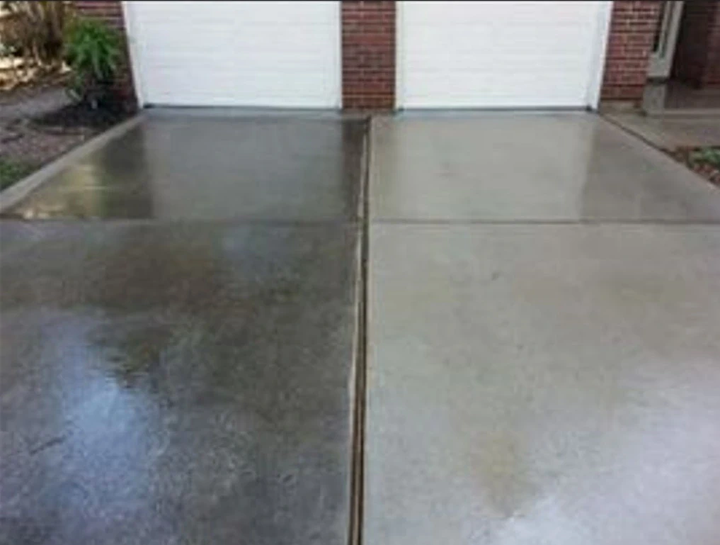 Side-by-side comparison of a stained driveway and a freshly cleaned surface after high-pressure washing